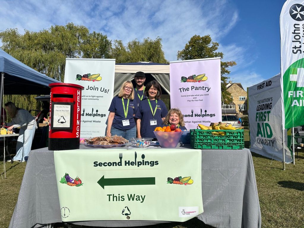 Second Helpigns team members at a stall at the dog show